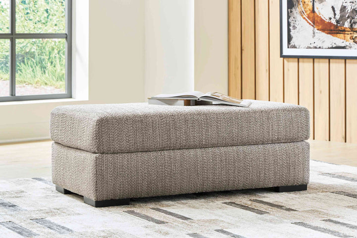 PC6960414 Lofwood Accent Ottoman In Fabric Upholstery - Fossil | Signature Design By Ashley