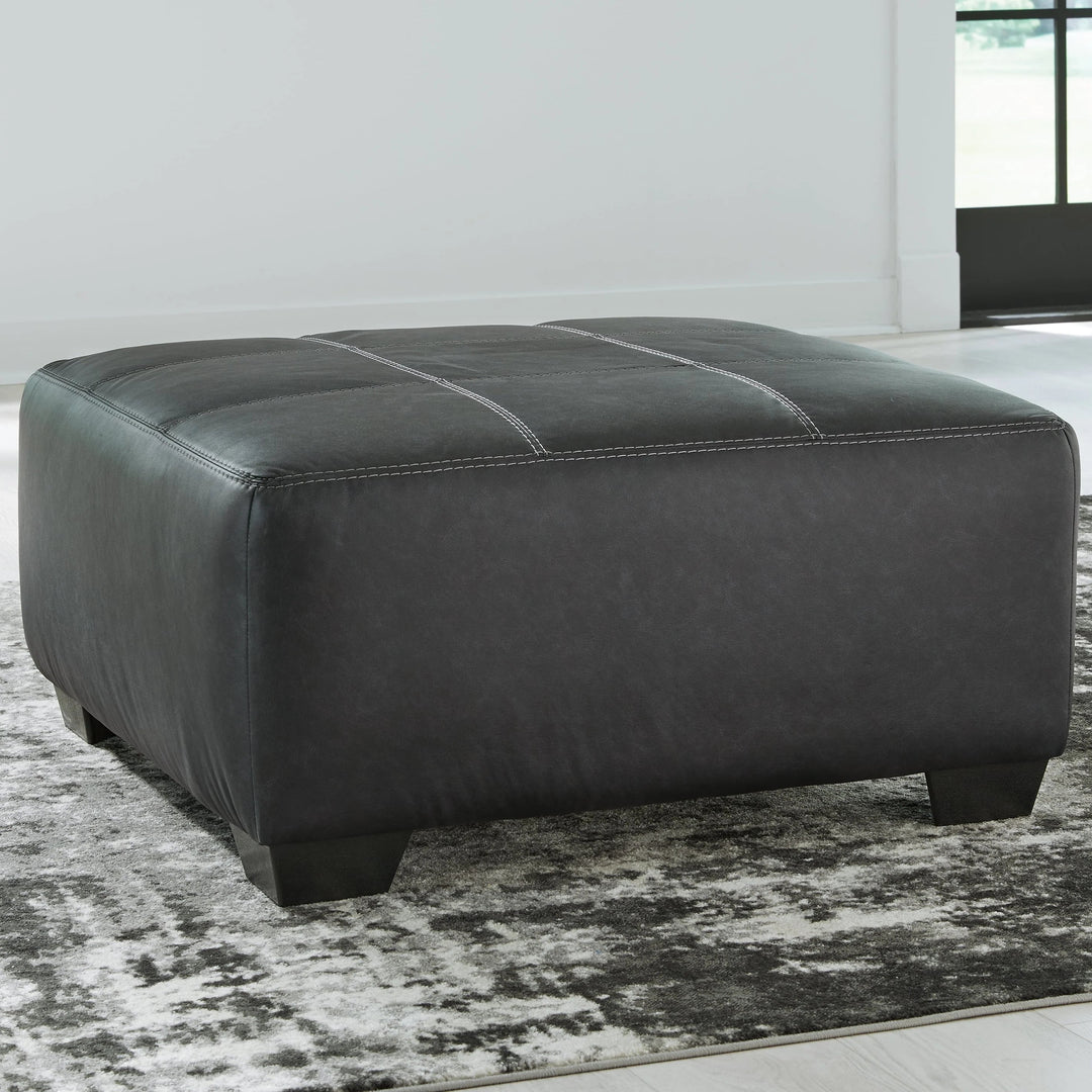 2990608 Brixley Pier Oversized Accent Ottoman In Leather Upholstery - Graphite | Benchcraft By Ashley